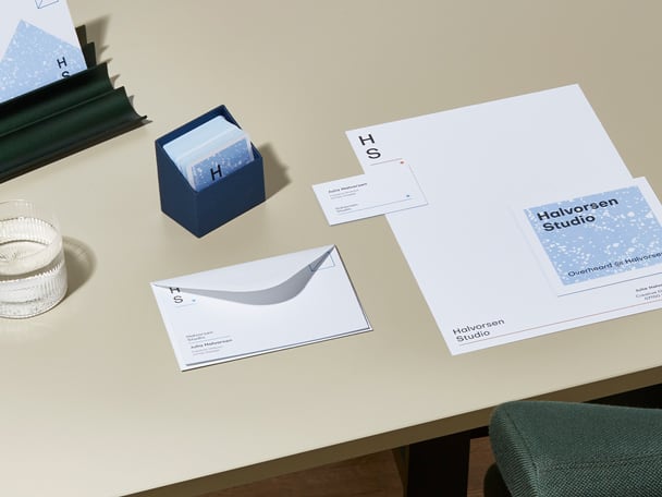 Collection of MOO Luxe print materials including premium letterhead, luxury business cards, mini cards, and high quality note cards with a coloured seam